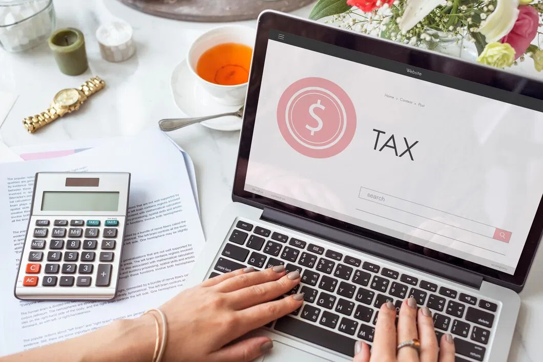 Client reviewing tax credits and personal tax paperwork with an adviser