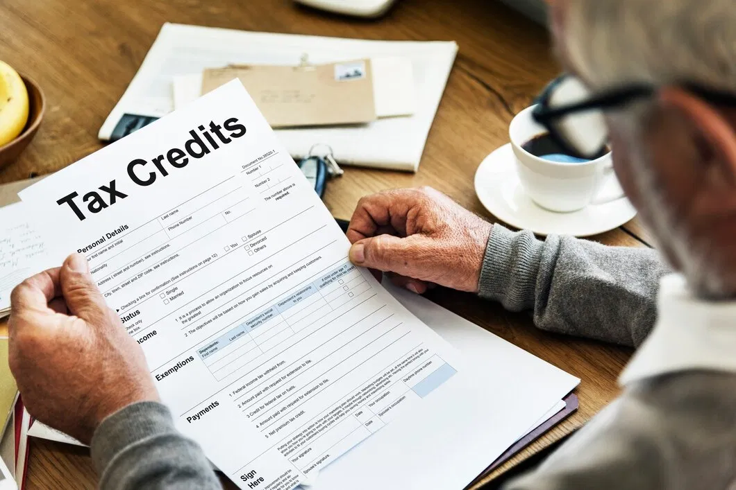 Tax adviser reviewing a client tax form in a London office